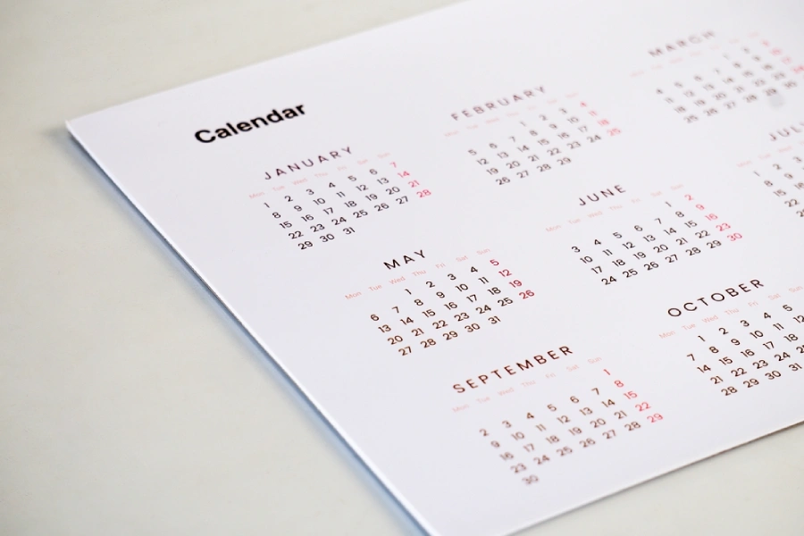 Calendar sitting on table depicts the concept of when to change toothbrush